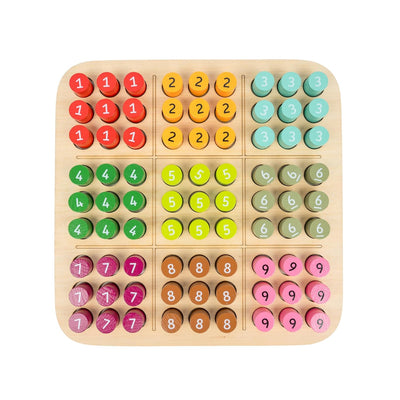 Wooden sudoku board with coloured number pegs