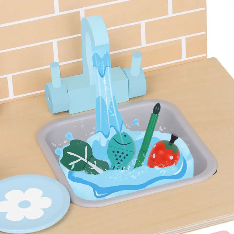 Pastel blue wooden play kitchen with brick backsplash