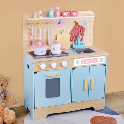 Pastel blue wooden play kitchen with brick backsplash